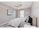 Neutral bedroom with ceiling fan, plush carpet and a comfortable bed at 8425 Codesa Way, Indianapolis, IN 46278