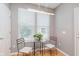 Cozy breakfast nook illuminated by natural light from the large windows with modern lighting at 8425 Codesa Way, Indianapolis, IN 46278