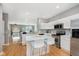 Spacious kitchen featuring an island, stainless steel appliances, and bright white cabinetry at 8425 Codesa Way, Indianapolis, IN 46278