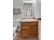 This bathroom features a single sink vanity, white toilet, and light gray walls at 8447 Wanda Lake Dr, Camby, IN 46113