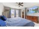 Relaxing bedroom with a flat screen tv, carpet, a ceiling fan, and an ensuite bathroom at 8447 Wanda Lake Dr, Camby, IN 46113