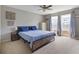 Spacious bedroom featuring carpet, a ceiling fan, and a bed with blue linens at 8447 Wanda Lake Dr, Camby, IN 46113
