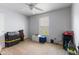 This bedroom has carpet and a ceiling fan with a window letting in natural light at 8447 Wanda Lake Dr, Camby, IN 46113