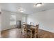 Open dining area with seating and a stainless steel refrigerator at 8447 Wanda Lake Dr, Camby, IN 46113