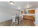 Bright eat-in kitchen area with wood floors and open to a large dining room at 8447 Wanda Lake Dr, Camby, IN 46113