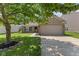 Brick home with manicured lawn, an attached garage, and a cozy, inviting curb appeal at 8447 Wanda Lake Dr, Camby, IN 46113