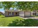 Charming one-story brick home with a well-maintained lawn and attached garage at 8447 Wanda Lake Dr, Camby, IN 46113