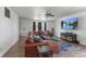 Inviting living room with a large sectional sofa, ceiling fan, and modern decor at 8447 Wanda Lake Dr, Camby, IN 46113