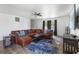 Comfortable living room with a large sectional sofa, ceiling fan, and a mounted television at 8447 Wanda Lake Dr, Camby, IN 46113