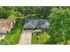 Charming single-story home with well-maintained landscaping, mature trees, and an expansive front yard at 8635 Bishops Ln, Indianapolis, IN 46217