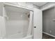 A bathroom features a shower/tub combination and tile flooring at 8635 Bishops Ln, Indianapolis, IN 46217