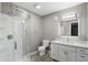 Bright bathroom with mosaic flooring, a glass enclosed shower, and a marble vanity at 8635 Bishops Ln, Indianapolis, IN 46217