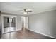 Bedroom featuring hardwood floors, a closet, and access to another room at 8635 Bishops Ln, Indianapolis, IN 46217