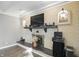 Close-up of a stylish brick fireplace with decorative mantel and modern electronics at 8635 Bishops Ln, Indianapolis, IN 46217