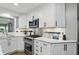Kitchen detail of the stainless steel oven and white cabinets at 8635 Bishops Ln, Indianapolis, IN 46217