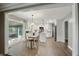 Modern kitchen features white cabinets, stainless steel appliances, and open access to the sunroom at 8635 Bishops Ln, Indianapolis, IN 46217