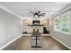 Cozy living room featuring a brick fireplace, a ceiling fan, and natural lighting at 8635 Bishops Ln, Indianapolis, IN 46217