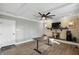 Comfortable living room with a brick fireplace, a ceiling fan, and neutral walls at 8635 Bishops Ln, Indianapolis, IN 46217