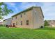 Two-story home featuring a spacious backyard with a charming patio and well-maintained lawn at 9605 Treyburn Green Way, Indianapolis, IN 46239