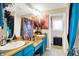 Bright bathroom with double sink vanity featuring colorful countertops and cabinets at 9605 Treyburn Green Way, Indianapolis, IN 46239