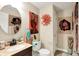 Stylish bathroom featuring a vanity with marble countertop and artistic wall decor at 9605 Treyburn Green Way, Indianapolis, IN 46239