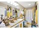 Elegant bathroom with artistic decor, a unique countertop, and ample lighting, providing a luxurious experience at 9605 Treyburn Green Way, Indianapolis, IN 46239
