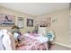 Cozy bedroom featuring stylish decor, neutral walls, and plenty of natural light at 9605 Treyburn Green Way, Indianapolis, IN 46239