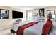 Bright bedroom with a cozy bed, mounted television, and decorative wall art, creating a relaxing ambiance at 9605 Treyburn Green Way, Indianapolis, IN 46239