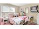 Cozy bedroom featuring stylish decor, neutral walls, and plenty of natural light at 9605 Treyburn Green Way, Indianapolis, IN 46239