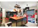 Kitchen with a copper-topped island, black cabinets, and stainless steel appliances at 9605 Treyburn Green Way, Indianapolis, IN 46239