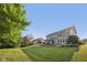 Large, green backyard featuring a gazebo, mature tree, and beautiful landscaping at 9840 N Anchor Bnd, McCordsville, IN 46055