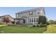 Exterior home shot highlighting the deck, gazebo, mature trees, and professionally landscaped yard at 9840 N Anchor Bnd, McCordsville, IN 46055