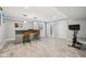 Spacious finished basement with bar, seating, wood-look floors, and exercise equipment at 9840 N Anchor Bnd, McCordsville, IN 46055