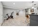 Finished basement featuring exercise area, entertainment space, and bar with seating at 9840 N Anchor Bnd, McCordsville, IN 46055