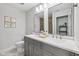 Bright bathroom featuring double sink vanity with gray cabinets and white countertop, with art on the wall at 9840 N Anchor Bnd, McCordsville, IN 46055