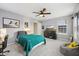 Inviting bedroom with cozy bedding, ceiling fan, and natural light at 9840 N Anchor Bnd, McCordsville, IN 46055