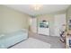 Comfortable bedroom with soft green walls and a dollhouse at 9840 N Anchor Bnd, McCordsville, IN 46055
