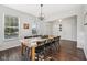 Dining room featuring a wooden table, chandelier, and lots of natural light at 9840 N Anchor Bnd, McCordsville, IN 46055