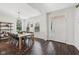 Bright dining room featuring a large table, hardwood floors, and ample natural light at 9840 N Anchor Bnd, McCordsville, IN 46055