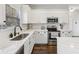Modern kitchen features stainless appliances, quartz countertops, and white cabinetry at 9840 N Anchor Bnd, McCordsville, IN 46055