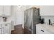 Close-up shot of the stainless steel refrigerator and counter with white cabinets in a modern kitchen at 9840 N Anchor Bnd, McCordsville, IN 46055