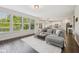 Open-concept living area with hardwood floors and seamless access to the kitchen at 9840 N Anchor Bnd, McCordsville, IN 46055