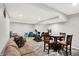 Open basement layout with a comfortable seating area, exercise equipment, and a charming game table at 10306 Mcclain Dr, Brownsburg, IN 46112
