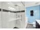 Modern bathroom with white subway tile shower, glass door, and heated towel rack offers a spa-like experience at 10306 Mcclain Dr, Brownsburg, IN 46112