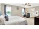 Relaxing bedroom featuring scenic outside views, a lounge chair, and ensuite bathroom at 10306 Mcclain Dr, Brownsburg, IN 46112