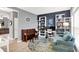 Stylish living room featuring a piano, bookshelves, modern decor, and ample natural light at 10306 Mcclain Dr, Brownsburg, IN 46112