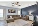 Comfortable living room with a large sectional sofa, neutral tones, and a stylish area rug at 10306 Mcclain Dr, Brownsburg, IN 46112
