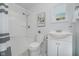 Bright bathroom featuring sleek fixtures, a shower and a sink with white cabinets and modern decor at 11802 Prairie Pl, Carmel, IN 46033