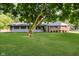 Charming ranch-style home featuring a well-manicured lawn and mature trees at 11802 Prairie Pl, Carmel, IN 46033