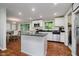 Modern kitchen featuring white cabinets, granite countertops, and stainless steel appliances at 11802 Prairie Pl, Carmel, IN 46033